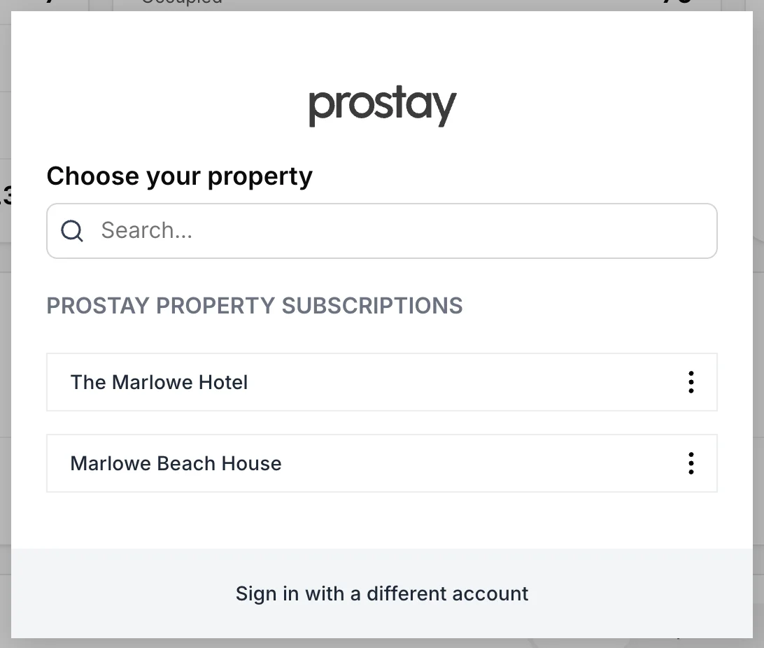 Ein Bereich mit der Überschrift „Choose your property“, darunter ein Suchfeld, eine Überschrift mit dem Titel „Prostay Property Subscriptions“ sowie zwei Zeilen: „The Marlowe Hotel“ und „Marlowe Beach House“, jeweils mit einem Drei-Punkte-Menü auf der rechten Seite. In der Fußzeile steht „Sign in with a different account“.