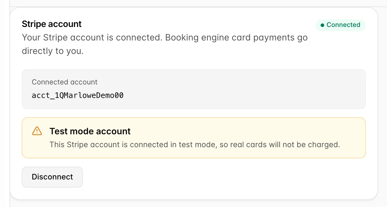 The same connected card with an amber banner between the account panel and the Disconnect button, headed Test mode account and reading This Stripe account is connected in test mode, so real cards will not be charged.