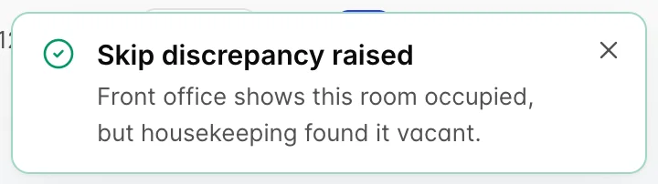 A success message headed Skip discrepancy raised, reading that front office shows this room occupied but housekeeping found it vacant.