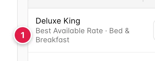The Room Type cell of the first row, reading Deluxe King with a smaller second line underneath: Best Available Rate, a middle dot, Bed & Breakfast.