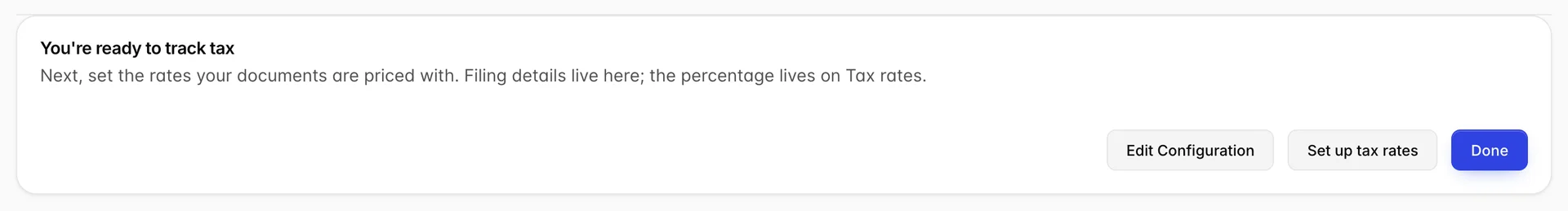 The final step of the Taxes wizard, headed "You're ready to track tax" over the line "Next, set the rates your documents are priced with. Filing details live here; the percentage lives on Tax rates." Three buttons sit below: Edit Configuration, Set up tax rates and Done.